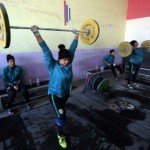 FEMALE WEIGHT-LIFTERS IN IRAQ TRAIN HARD TO ALSO BOOST FAMILY FINANCES