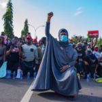 Here Are 6 Iconic Images From #EndSARS Protests Across The World
