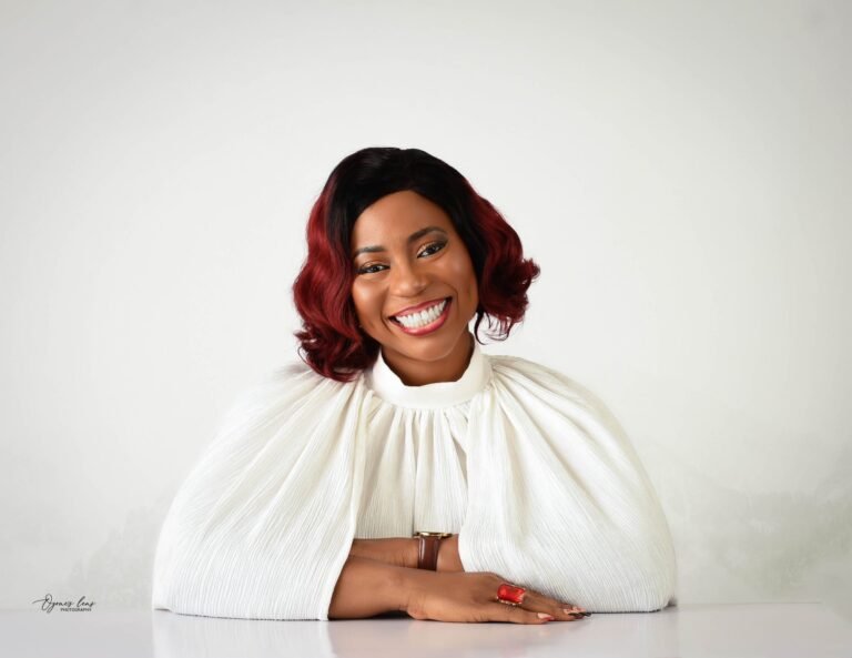 Damilola GlowVille, certified marriage counselor and author of Fight Like A Winner, smiling confidently during a relationship counseling session.