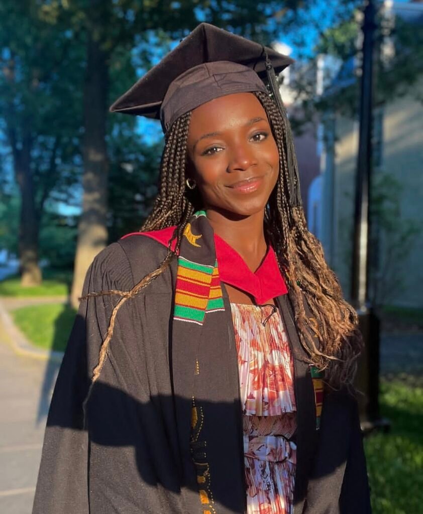 Yinka Ogunbiyi wearing her graduation gown at Harvard University