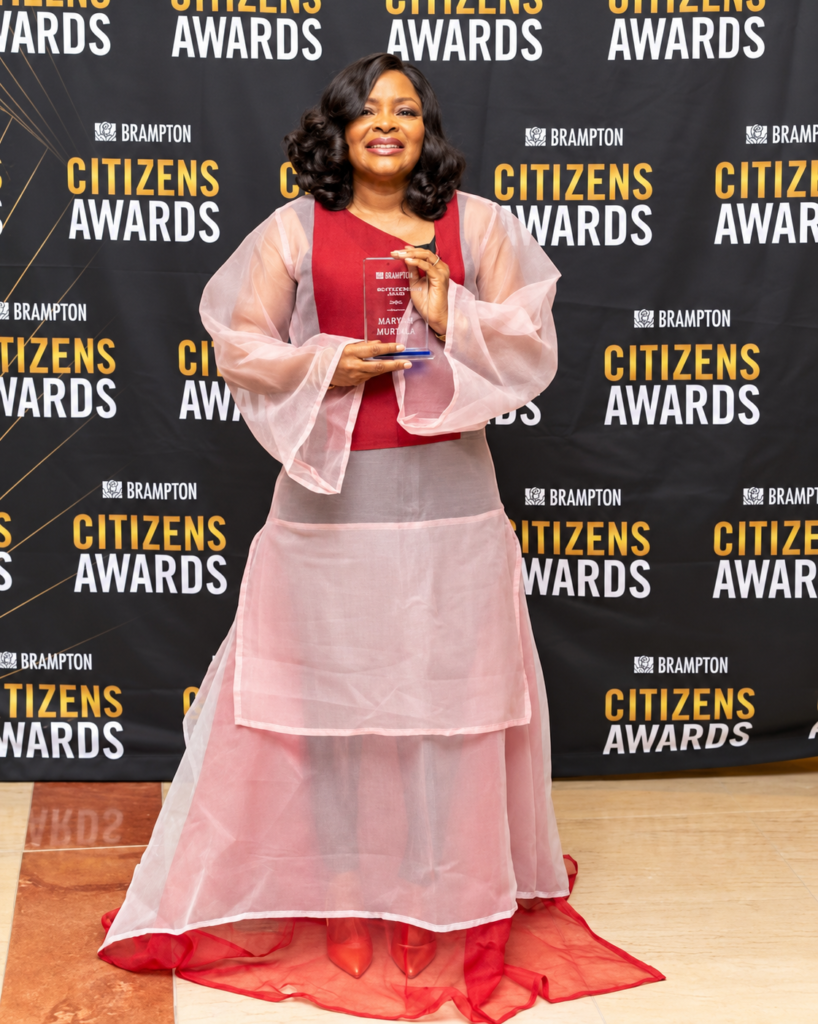 Maryam Muritala holding an award at the City of Brampton Citizens Awards