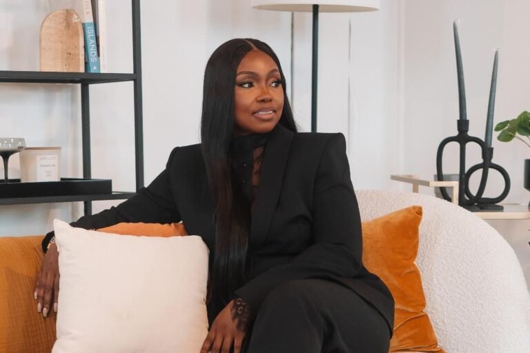Kesiena E. Edionhon: Helping Professionals Turn Experience into Opportunity Kesiena E. Edionhon wearing a black suit, seated on a sofa.