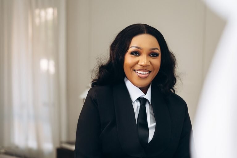 Wendy Nwajiufor Is Helping Women and Newcomers Build Their Place in Tech Wendy Nwajiufor, Founder and President of WinTECH Community, smiling in a black suit and tie.